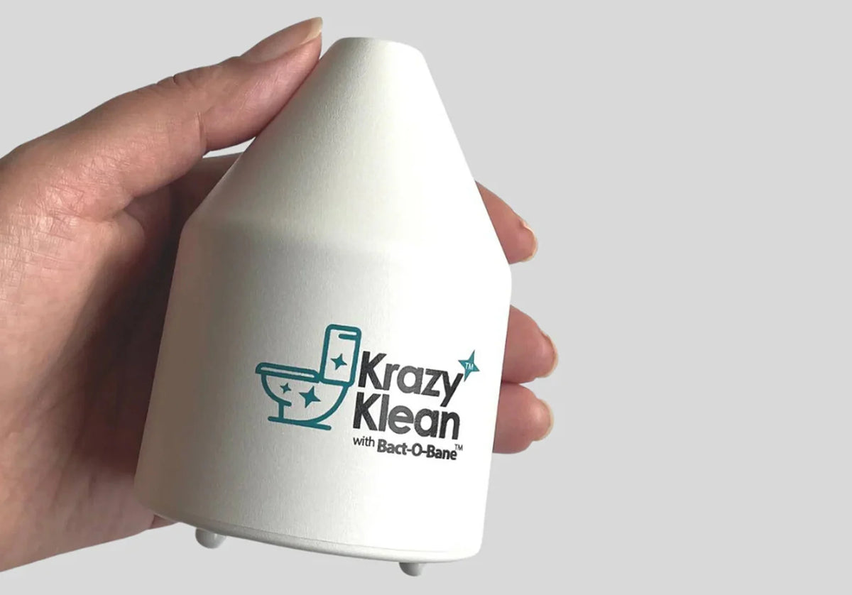 Hand holding a white device with 'Krazy Klean' logo and toilet graphic.